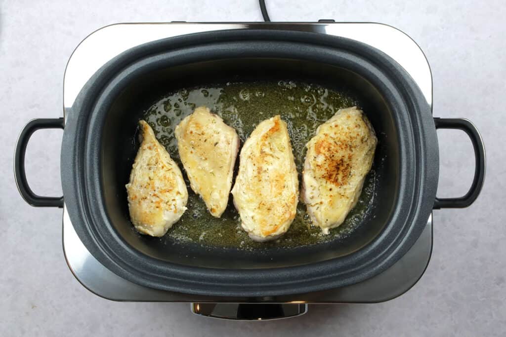 Pan frying chicken breasts in a slow cooker