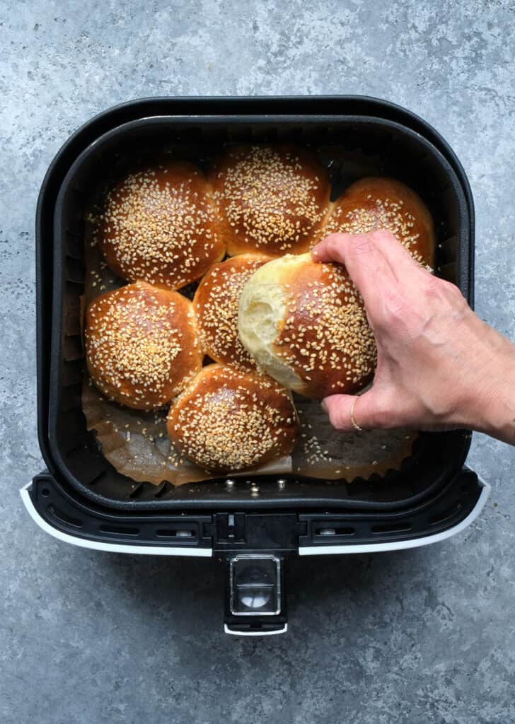 Bread rolls in an air fryer basket