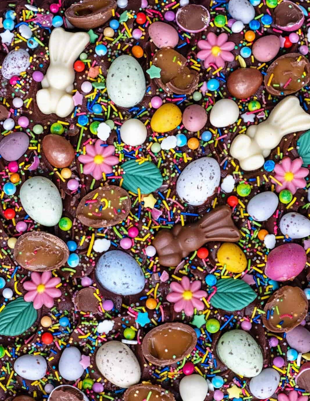 chocolate cake decorated with mini eggs and other Easter chocolates
