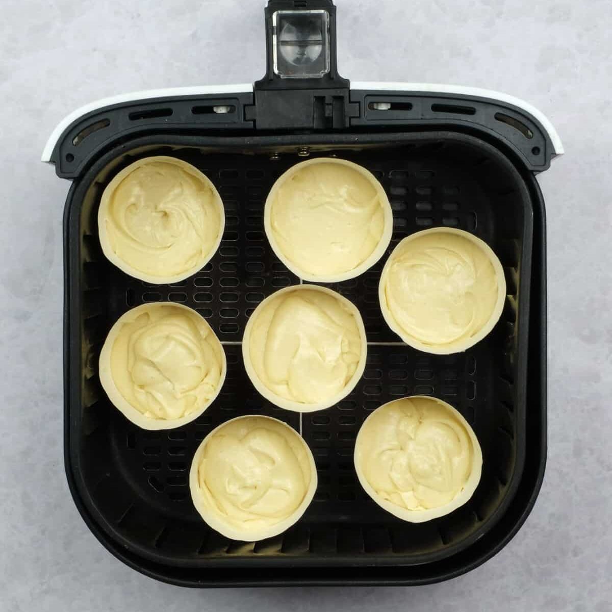 Vanilla cupcakes in an air fryer before baking