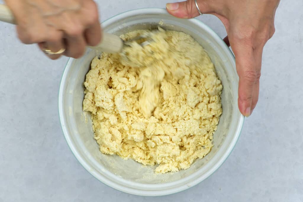 Stirring dough for scones in a bowl