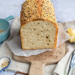 Sourdough Sandwich Bread, sliced, on a wooden board