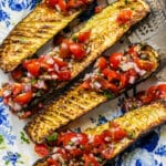 Close up on Air fryer zucchini served with fresh tomato sauce