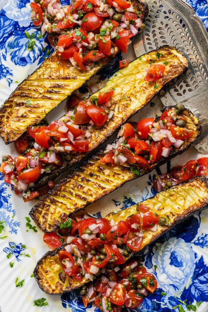 Close up on Air fryer roasted zucchini served with fresh tomato sauce