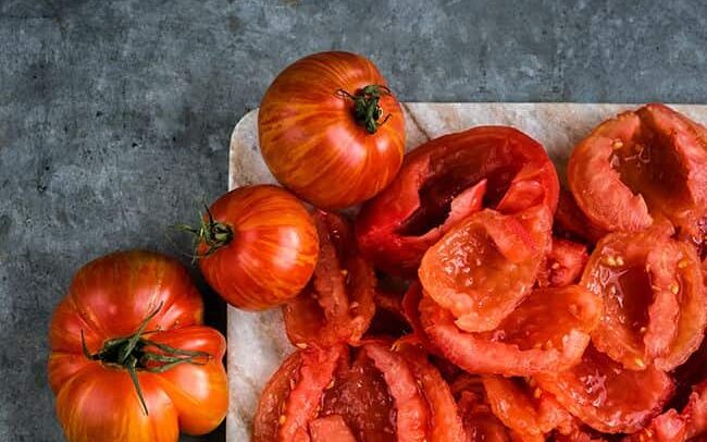 chopped tomatoes on a board