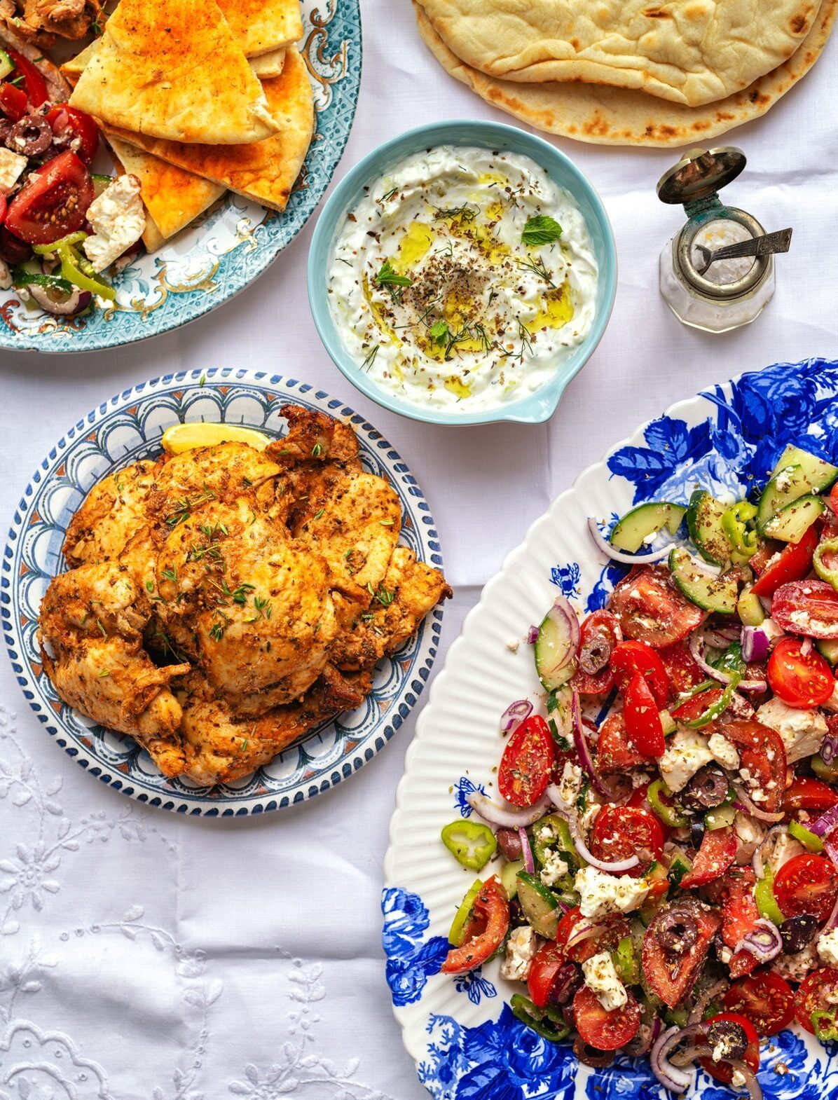 A plate of food on a table, perfectly complemented by a homemade tzatziki sauce recipe.