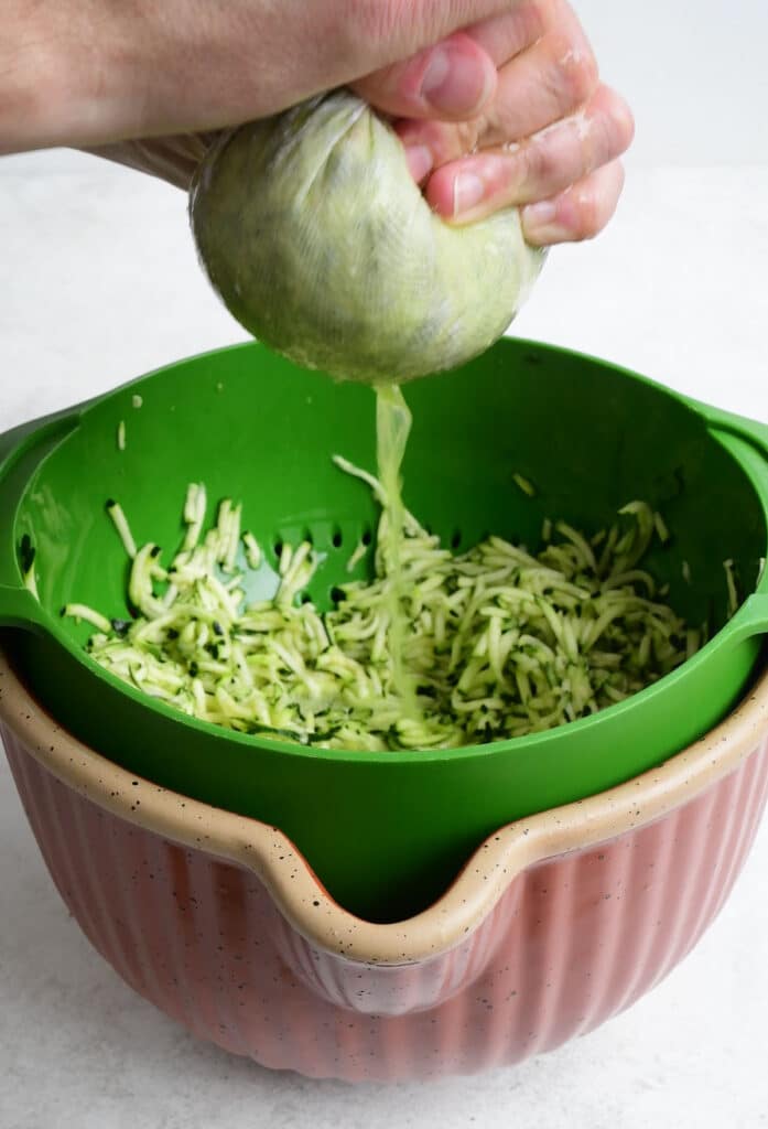 Squeezing moisture out of grated zucchini