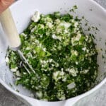 making spinach and feta filling in a bowl