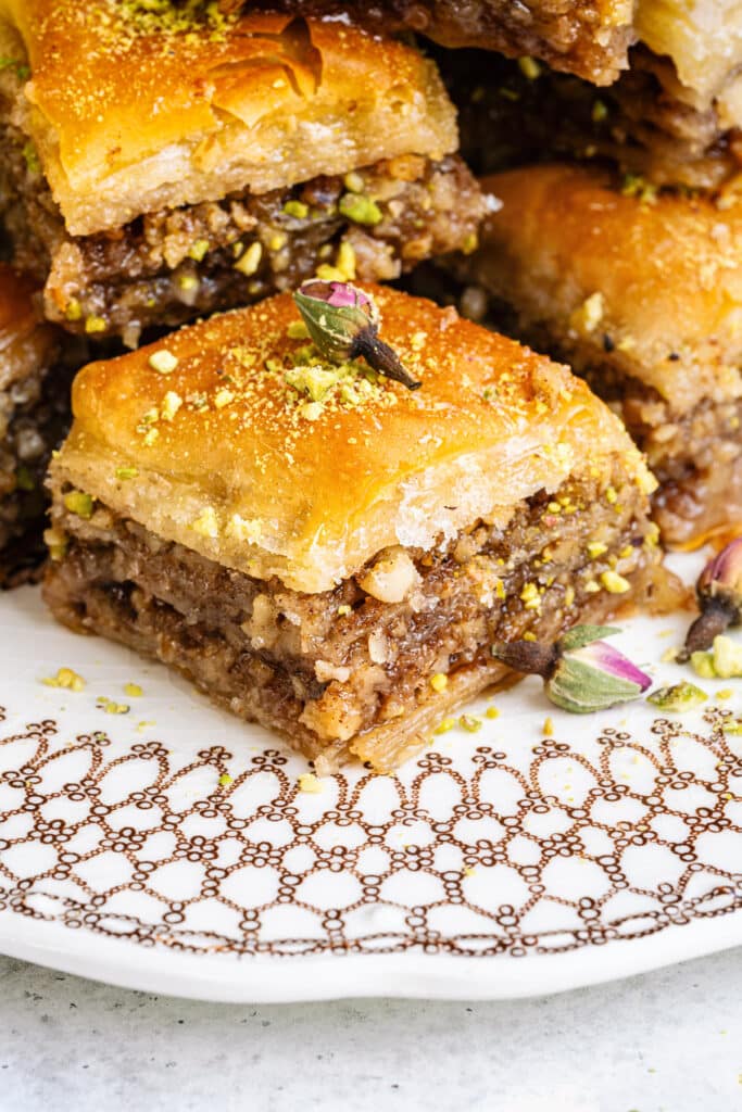 Close up on a slice of Greek baklava, side view, to show the flaky layers