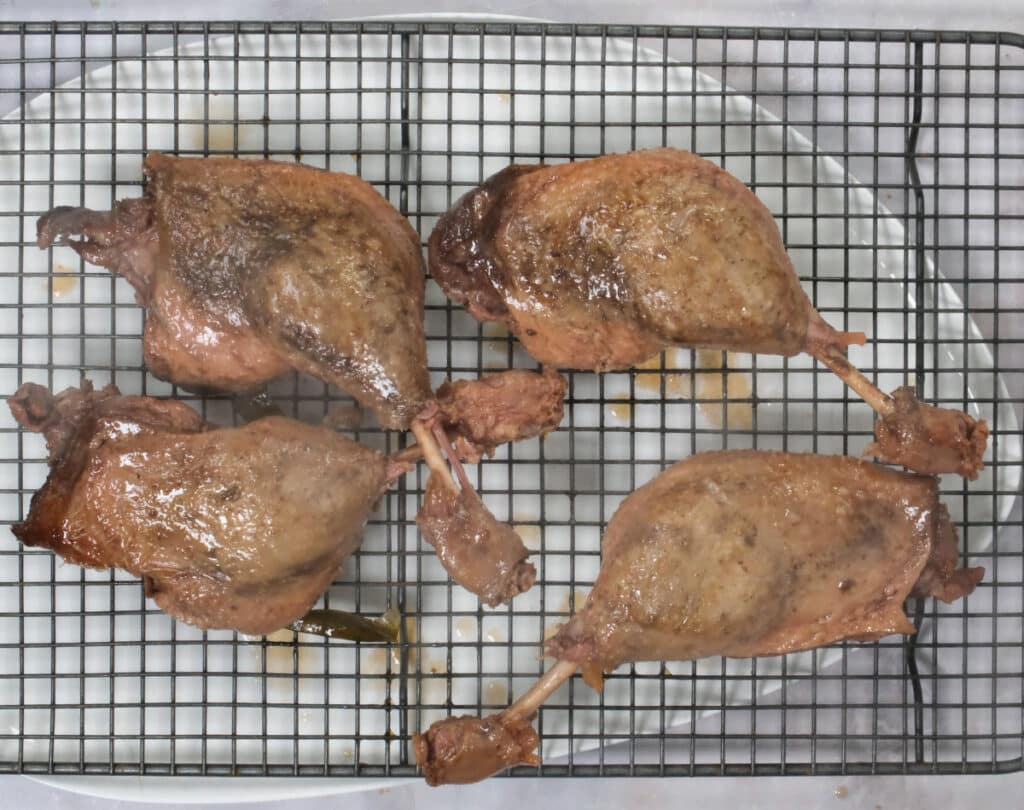 duck legs on a cooling rack