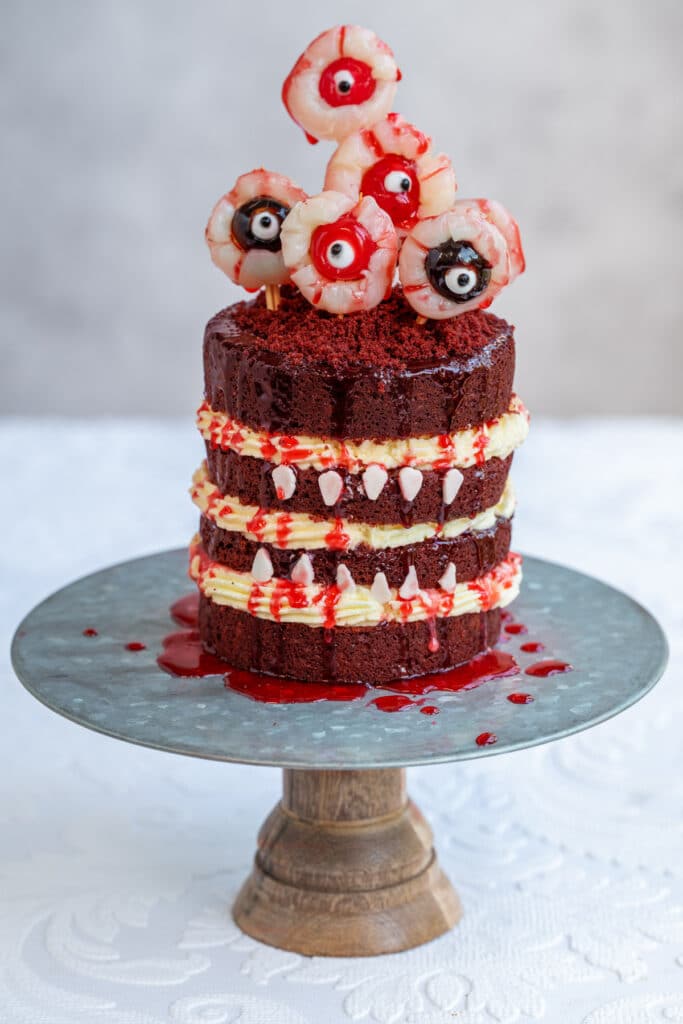 spooky halloween cake decorated with edible blood and eyeballs