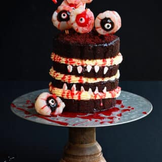 Spooky Halloween Cake decorated with blood drip and eyeballs
