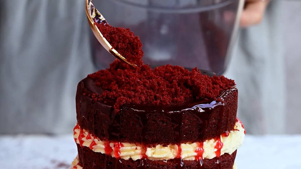 decorating halloween cake with red velvet cake crumbs