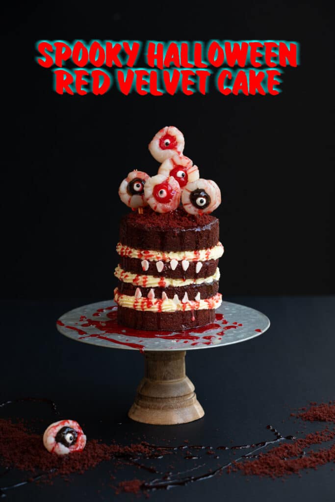 Spooky Halloween cake dripping with blood and decorated with eyeballs