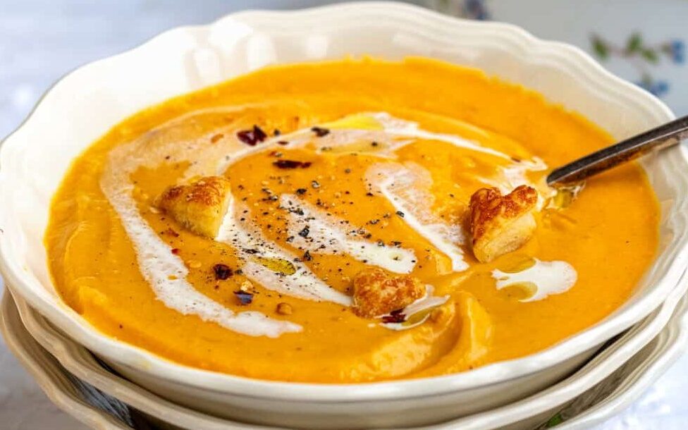 Air fryer butternut squash soup in a bowl with soup on the side