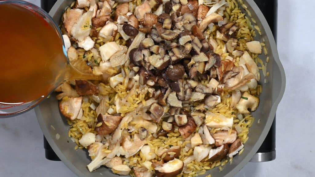 cooking mushroom orzo in a pan