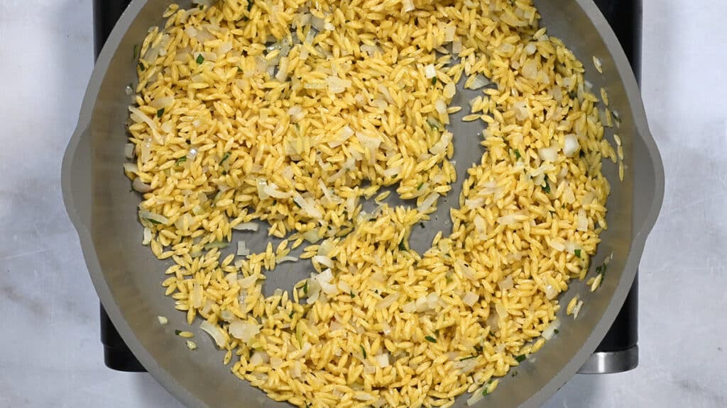 orzo pasta cooking in a pan