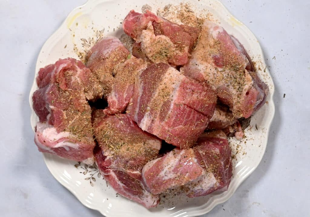 seasoned chunks of pork shoulder on a plate