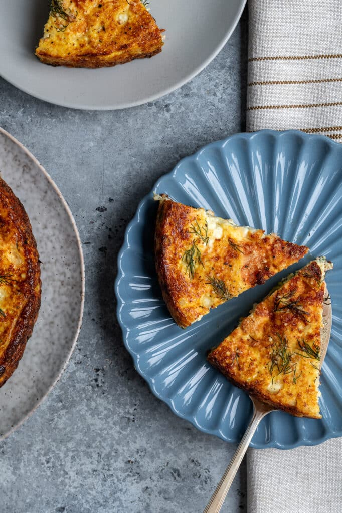 two slices of cottage cheese frittata on a blue plate