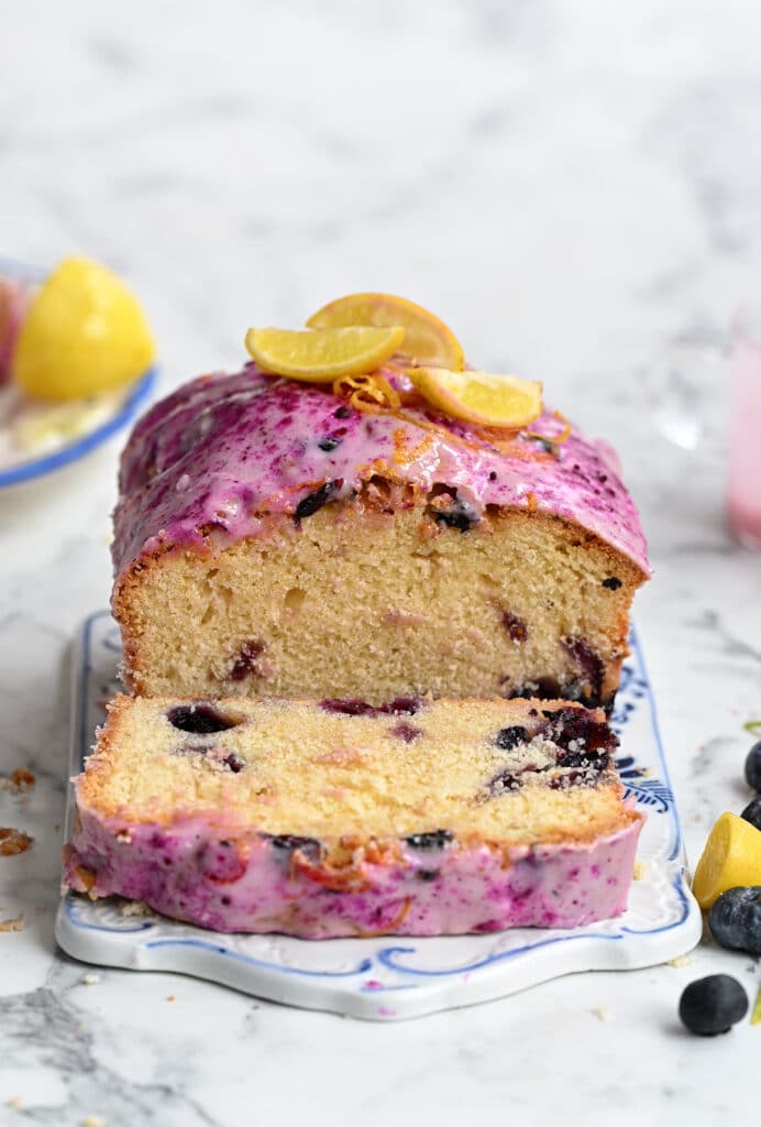 lemon bluberry cake, sliced, topped with pink glaze