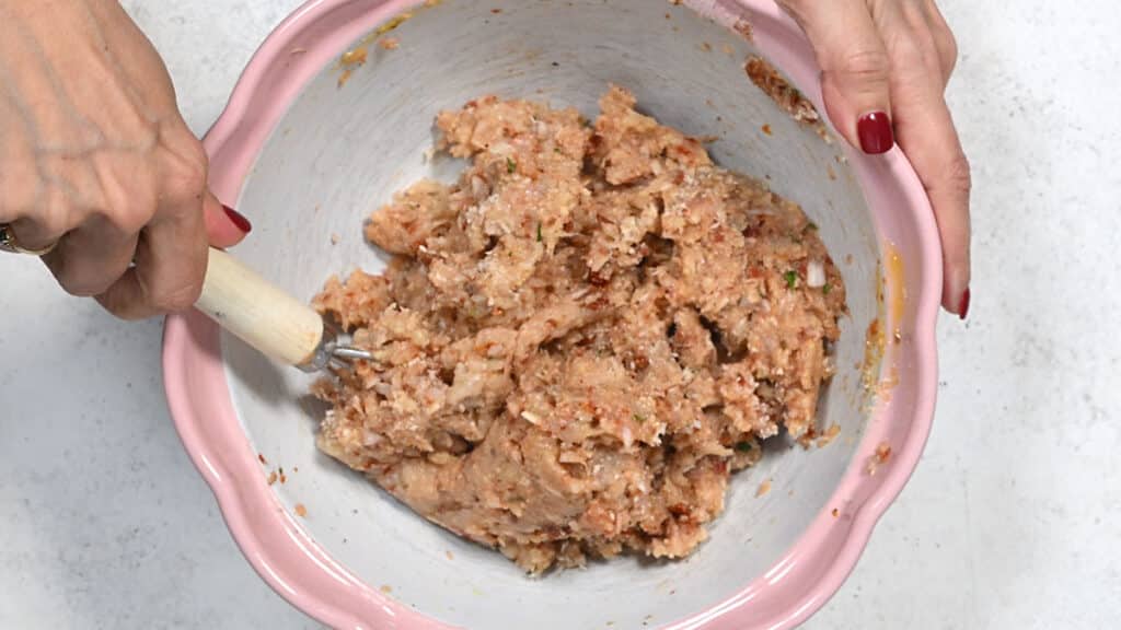 preparing meatballs in a bowl