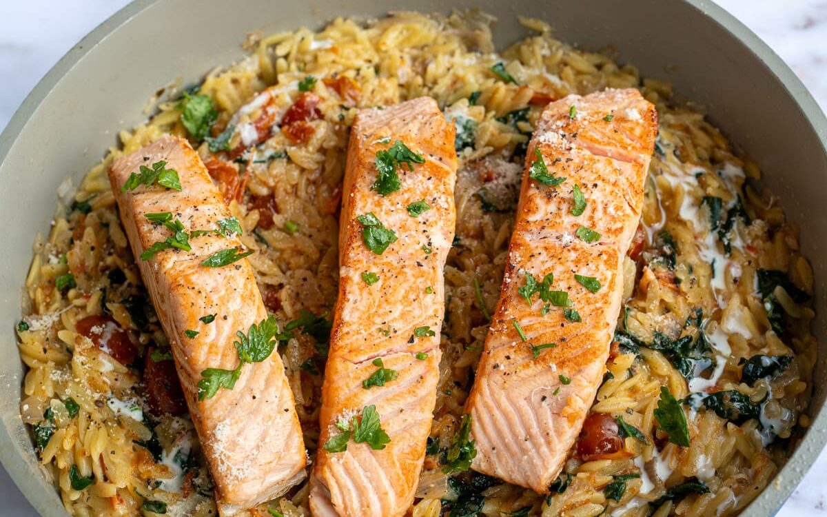 Tuscan Salmon Pasta with orzo, sundried tomatoes and spinach in a creamy garlic parmesan sauce