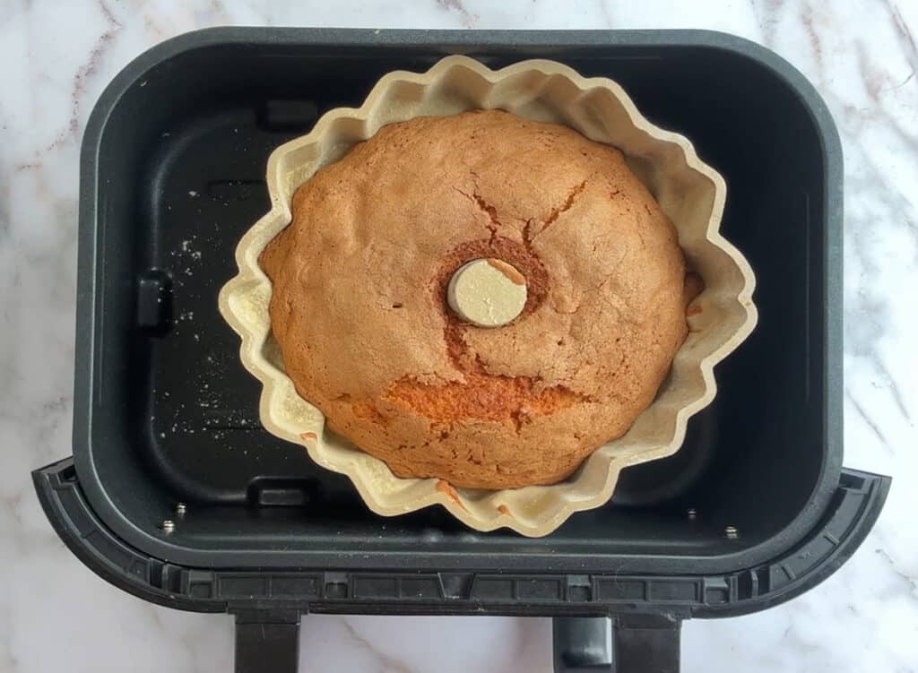 baked rum cake in the basket of an extra large air fryer