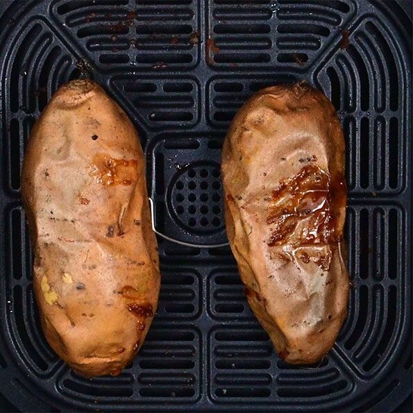 Two images side by side: on the left, two whole sweet potatoes in an air fryer basket; on the right, a cooked sweet potato split open on a plate, revealing its orange interior.