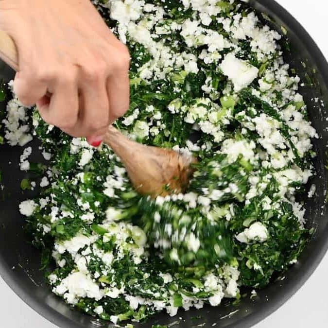 spinach pie filling in a pan