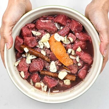 marinating beef to make greek stifado