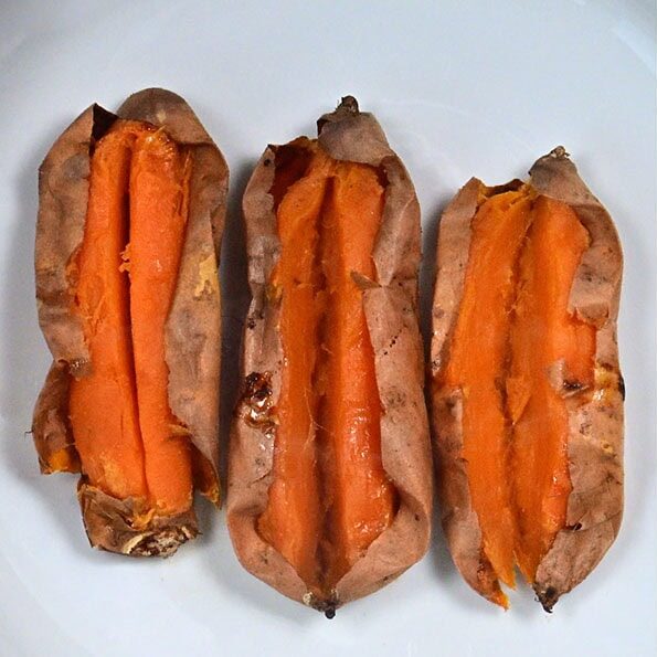 Left: Three baked sweet potatoes with slits down the center on a white plate. Right: Peeled sweet potatoes and a large dollop of peanut butter in a mixing bowl with a mixer.