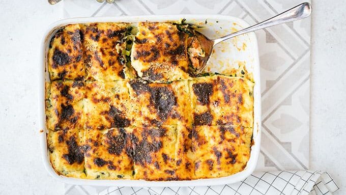 Wild salmon lasagna with a slice taken out