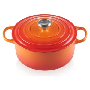 Le Creuset 5.5-quart enameled cast iron round Dutch oven in orange Flame, on a white background.